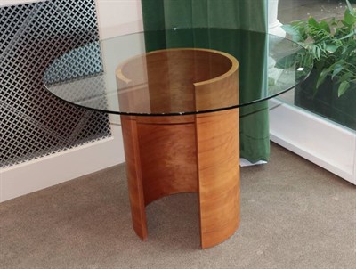 Lot 491 - Tom Schneider: A Circular Glass Centre Table, modern, with curved walnut circular form base,...
