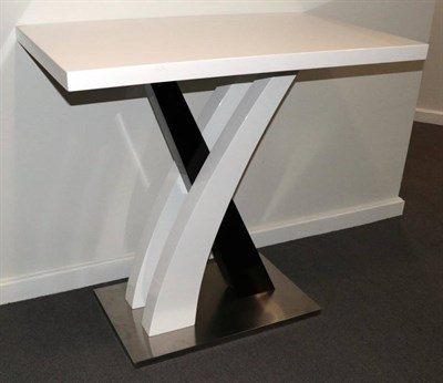 Lot 492 - Avent Garde: A White and Black Laminated Console Table, modern, the rectangular top above...