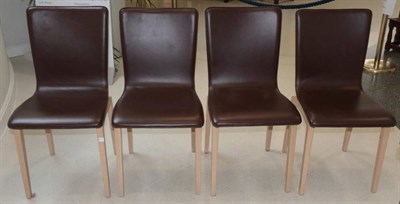 Lot 494 - Ligne Roset: A Set of Four Brown Leather and Oak Dining Chairs, modern, 44cm by 47cm by 88cm
