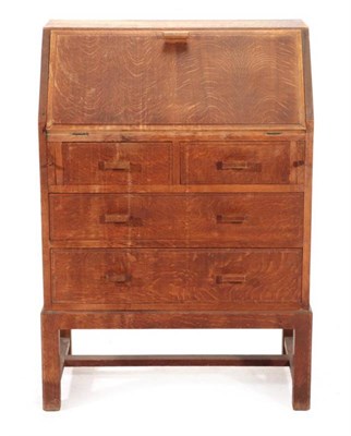 Lot 496 - A 1950's Heal's Oak Bureau, the fall front enclosing pigeon holes above two short and two long...
