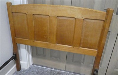 Lot 497 - A Pair of English Oak 4' Panelled Beds, designed by Gordon Russell, the headboards with shaped...
