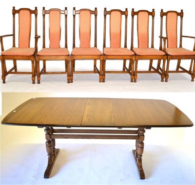 Lot 503 - An Ercol Ash Extending Dining Table, with two additional leaves, on turned bulbous legs with sledge