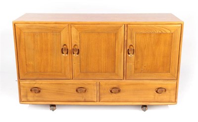 Lot 509 - An Ercol Windsor Style Elm Sideboard, of three cupboard doors with two drawers below, on...