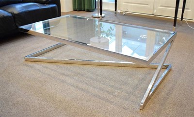 Lot 524 - A 1970's Chromed Metal and Glass Coffee Table, of rectangular, on a square tubular frame with Z...