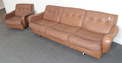 Lot 535 - A 1970's Danish Three-Seater Sofa and Matching Chair, covered in buffalo hide with stitch...