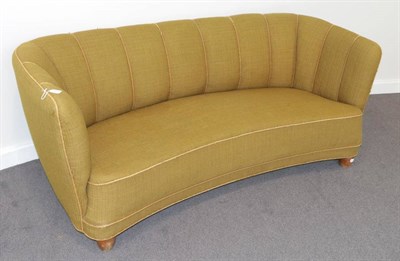 Lot 537 - A 1940's Danish Design Curved Sofa, upholstered in olive green fabric with rope detail, 173cm...