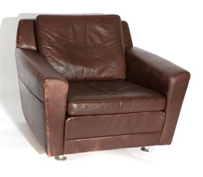 Lot 544 - A 1960's Danish Lounge Chair, upholstered in brown leather, with square form arms and two cushions