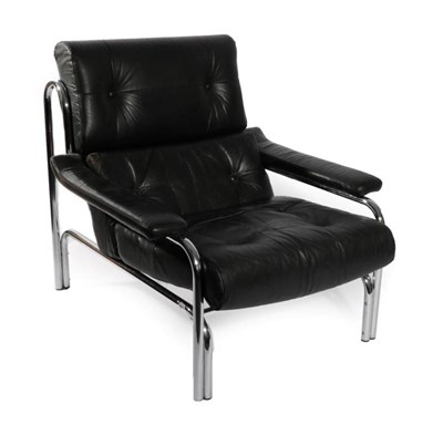 Lot 555 - An Alfa Lounge Chair, designed by Tim Bates, circa 1960's, covered in worn and buttoned black...