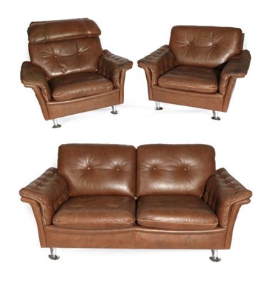 Lot 558 - A 1970's Danish Three Piece Lounge Suite, in the manner of Skippers, covered in buttoned brown...