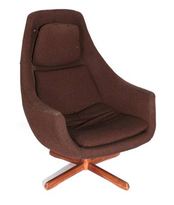 Lot 562 - A 1970's Bucket Shaped Swivel Arrmchair, covered in wool fabric, on four teak legs, 74cm by 70cm by