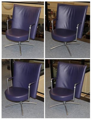 Lot 565 - Erik Jorgensen: A Set of Four Danish Swivel Armchairs, modern, covered in purple leather with...