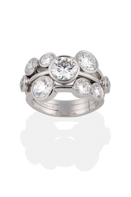 Lot 130 - A Platinum Diamond ''Raindance'' Ring, by Boodles, nine round brilliant cut diamonds in rubbed over