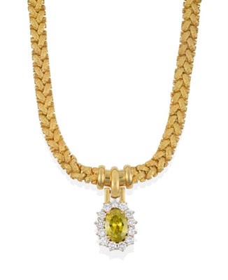 Lot 183 - A Diamond Pendant Necklace, an oval cut yellow-green coloured diamond within a border of round...