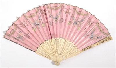 Lot 2001 - A Late 18th or Early 19th Century Bone Fan, classically carved and pierced. The double leaf, of...