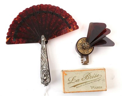 Lot 2044 - A Small Art Nouveau Folding Fan, with hallmarked silver guards, repoussé with period designs, with