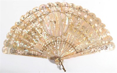 Lot 2048 - A European Pink Mother-of-pearl Brisé Fan, carved and pierced, silvered and gilded in floral...