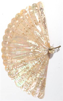 Lot 2048 - A European Pink Mother-of-pearl Brisé Fan, carved and pierced, silvered and gilded in floral...