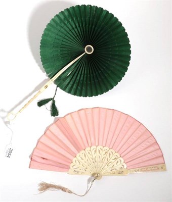 Lot 2054 - A Bone Handled Parasol Fan, mounted with dark green silk, the handle carved and ending in a...