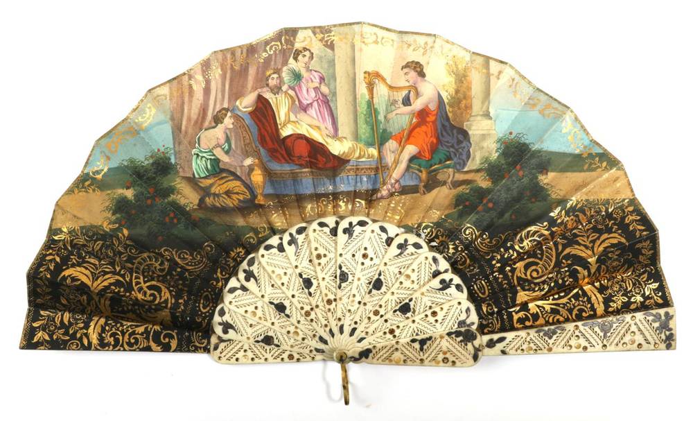 Lot 2061 - A Colourful Mid-19th Century Lithographed Fan, the double paper leaf mounted on carved, pierced and