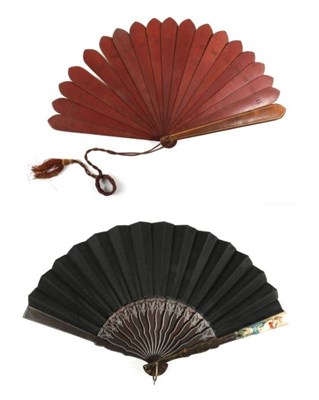 Lot 2077 - A 19th Century Wooden Fan, possibly Bavarian, the leaf of plain black silk mounted onto black...