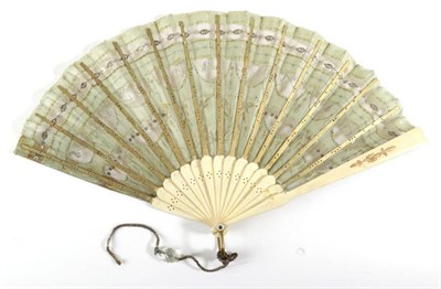 Lot 2087 - An Early 20th Century Sequin Fan, the pale green silk leaf mounted on bone, the sequins in gold and