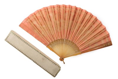 Lot 2102 - A Shocking Pink (à la Schiaparelli) Fan, the silk leaf mounted on horn or resin sticks, carved and