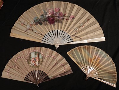 Lot 2112 - An Early 20th Century Dusky Grey Mother-of-Pearl Fan, the taupe silk leaf with a cartouche...