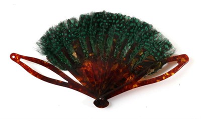 Lot 2137 - A 19th Century Tortoiseshell Brisé Fan, topped with iridescent blue feathers, the upper guard with