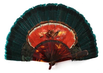 Lot 2138 - A Victorian Feather Fan, mounted on faux tortoiseshell sticks, the deep turquoise border...