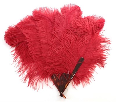 Lot 2144 - An Early 20th Century Strong Strawberry Red Ostrich Feather Fan, with four tortoiseshell gorge...