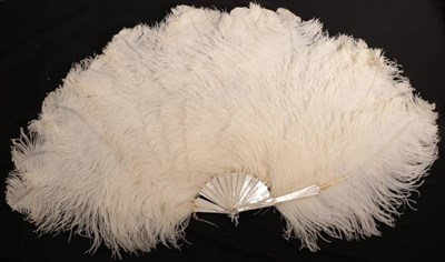 Lot 2146 - Churchill: An Extravagant White Ostrich Feather Fan, the frothy feathers mounted on white mother of