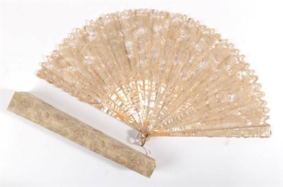 Lot 2155 - An Early 20th Century Fan, the monture of pink mother-of-pearl, the bone ribs overlaid with a light