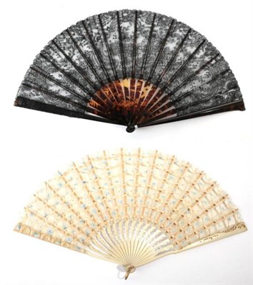 Lot 2158 - A Good Black Bobbin Lace Fan, both the monture and the ribs of tortoiseshell, the leaf designed...