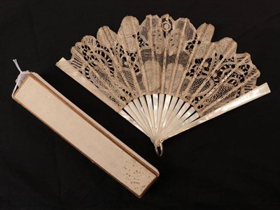 Lot 2159 - An Early 20th Century White Mother-of Pearl Fan, mounted with a light and airy tape lace leaf, with