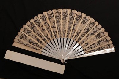 Lot 2171 - A Late 19th Century Belgian Bobbin Lace Fan Leaf, mounted on white mother-of-pearl, the workmanship