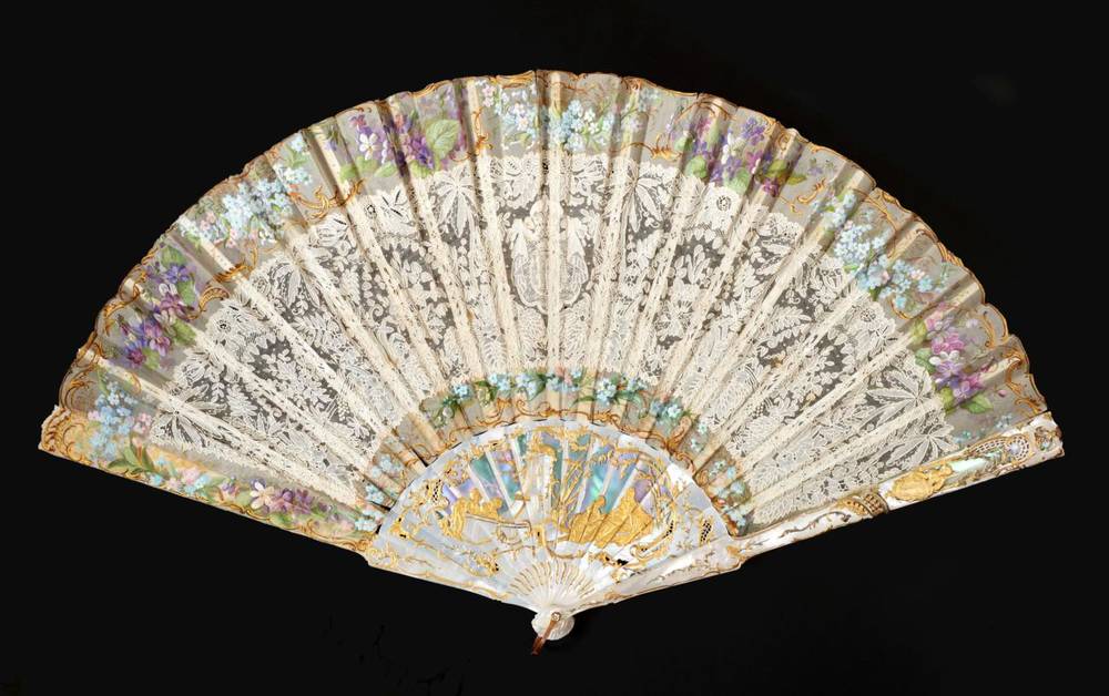 Lot 2175 - A Very Fine and Unusual Brussels Lace Fan, the leaf mounted on pierced and gilded...