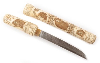 Lot 2180 - A Late 19th Century Japanese Ivory Tanto, the knife handle and sheath extravagantly decorated...