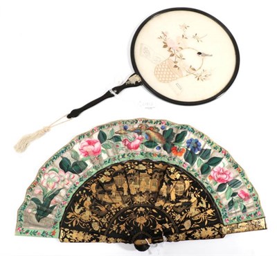 Lot 2181 - A 20th Century Chinese Fixed Fan of Lacquered Wood, the circular frame containing a cream silk...