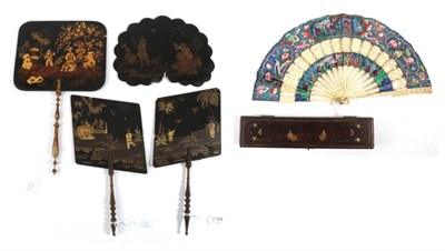 Lot 2184 - An Unusual Pair of Black Lacquer 19th Century Face Screens or Fixed Fans, of asymmetrical form,...