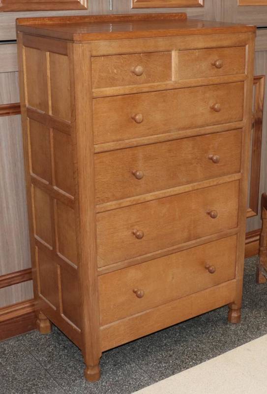 Lot 283 - Mouseman: A Robert Thompson of Kilburn Panelled English Oak Tall Chest of Drawers, with raised...