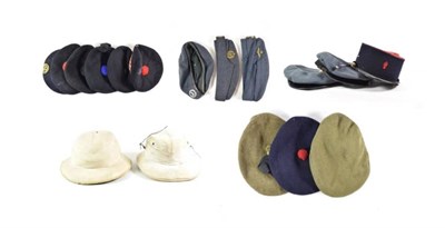Lot 74 - A Second World War RAF Peaked Cap and Two Side Caps, with brass badges, a similar peaked cap...
