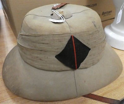 Lot 75 - An Early 20th Century Wolsley Style Pith Helmet, the skull of four panels of khaki cloth, the eight