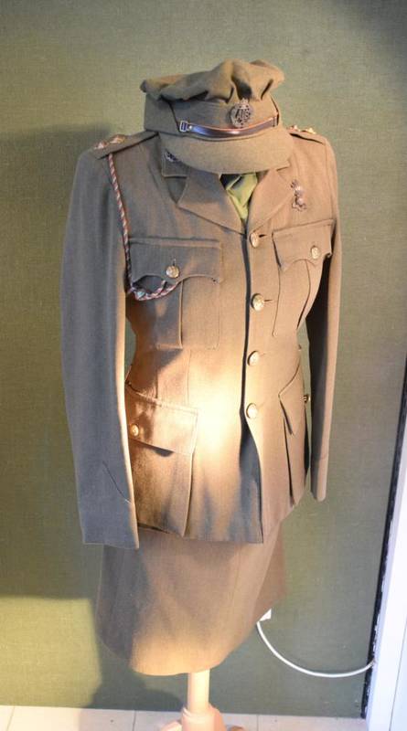 Lot 81 - A Second World War Service Uniform to a Woman of the ATS, comprising green tunic with rank...
