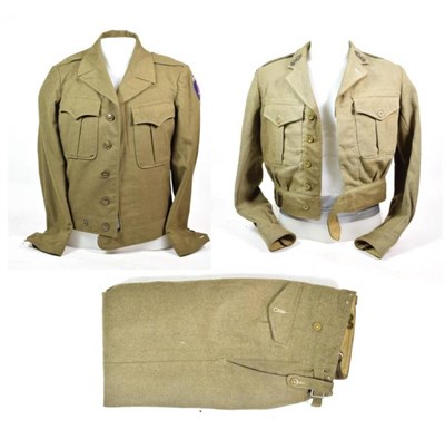 Lot 82 - A Second World War US Field Jacket, in olive green wool, with SHAEF formation badge to the left...