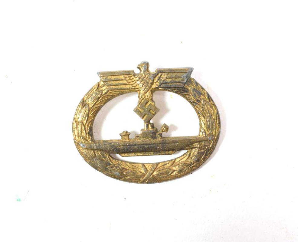 Lot 92 - A German Third Reich U-Boat War Badge, in gold washed metal, the reverse indistinctly marked,...