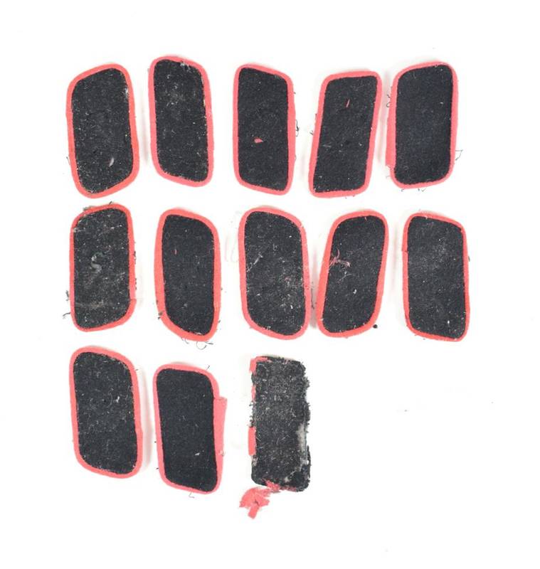 Lot 93 - A Collection of Thirteen German Third Reich Black Wool Panzer Collar Patches, with red waffenfarbe