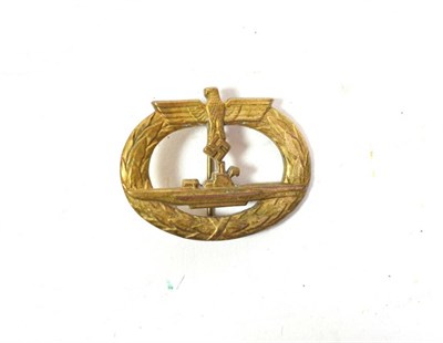 Lot 97 - A German Third Reich U-Boat War Badge, in gilt metal, the reverse with vertical needle pin and...