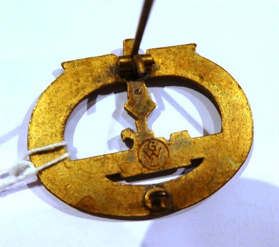 Lot 97 - A German Third Reich U-Boat War Badge, in gilt metal, the reverse with vertical needle pin and...