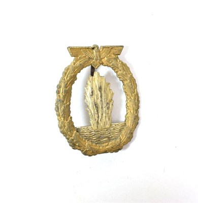 Lot 99 - A German Third Reich Minesweeper Badge, the reverse with vertical sword shape pin, moulded...