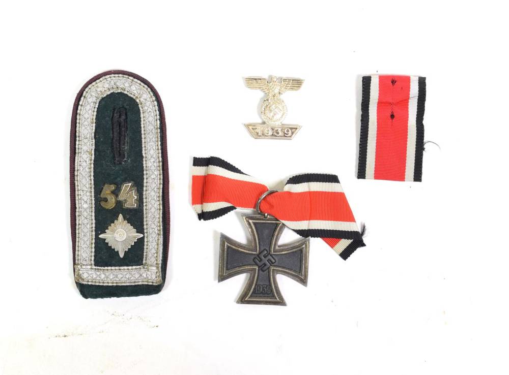 Lot 100 - A German 1939 Third Reich Iron Cross, second class, the suspender ring stamped 65; a 1939...
